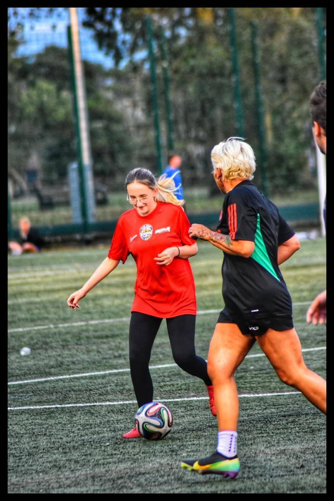 Players training and playing football